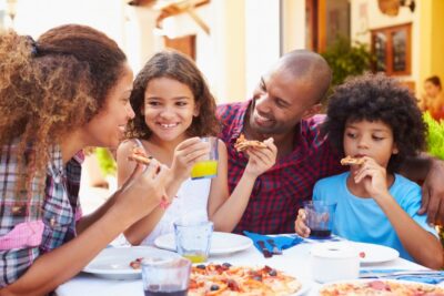 Happy Family Eating Pizza After their Fun Activity in Olympia